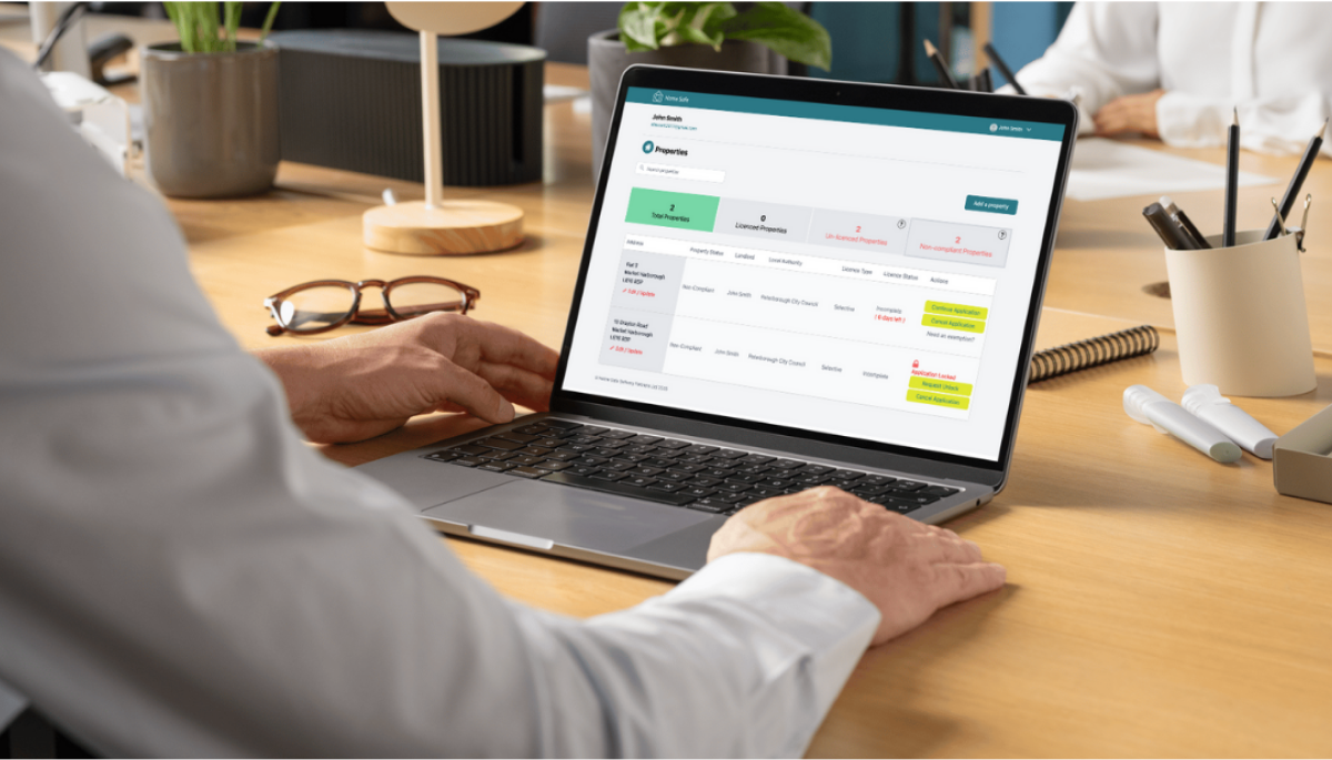 Man Applying For A Licence Through Home Safe On A Laptop
