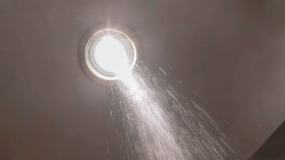 Water pouring through light fitting